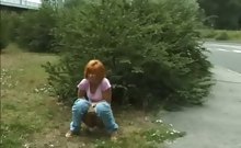 Dame peeing outdoors