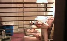 Blonde window voyeur