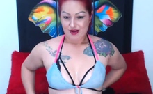 Redhead camgirl in three bras stripping