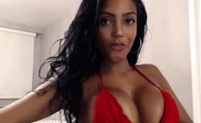 Busty babe playing with her big boobs